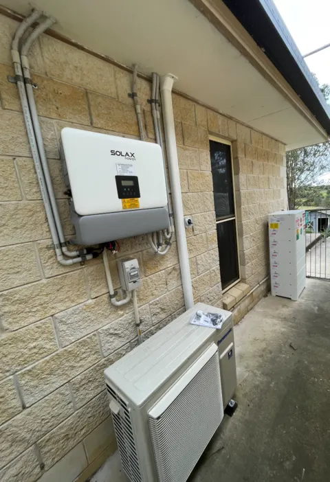SolaX Power hybrid inverter & battery — outdoor wall install